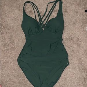 Green plus size one piece w criss cross back